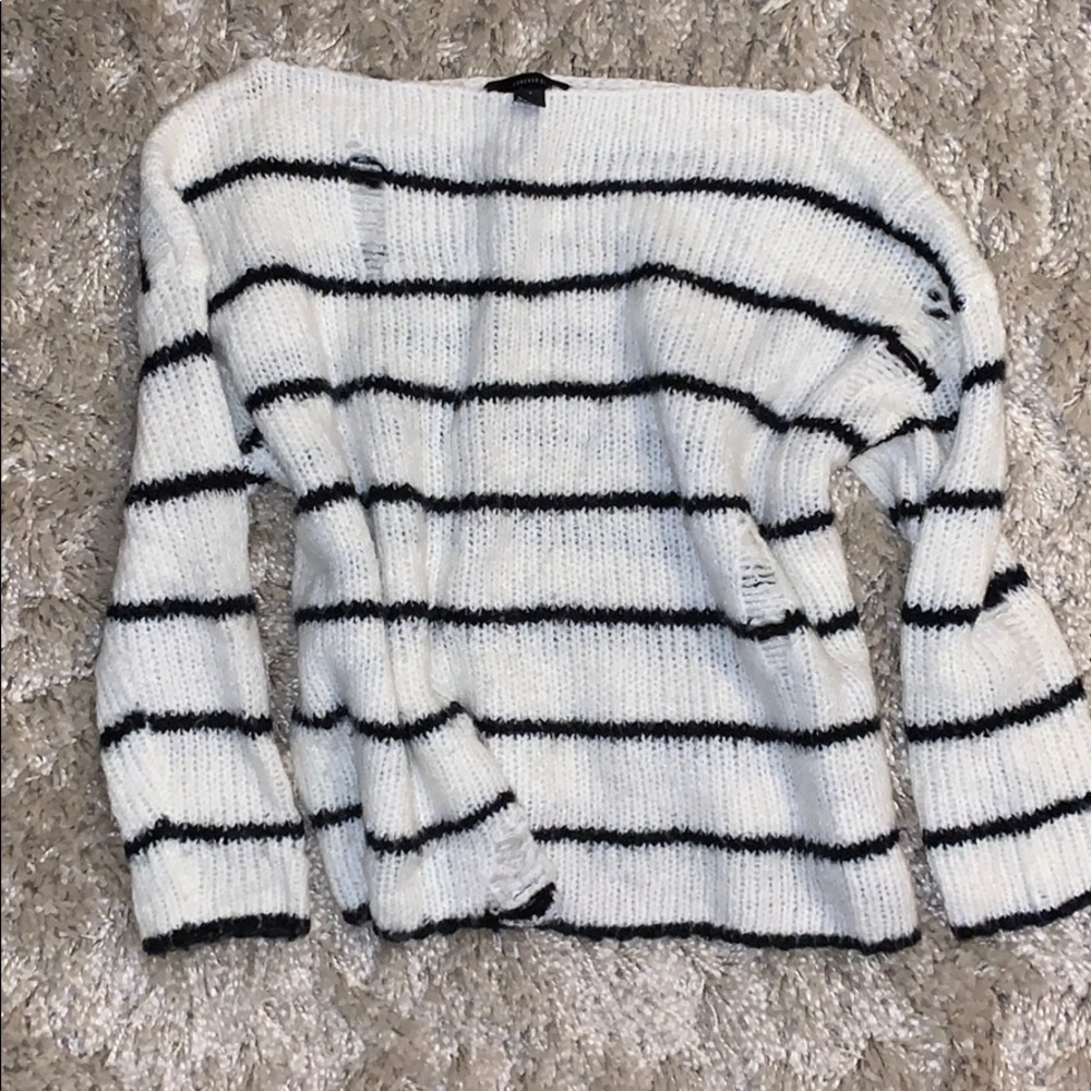 Distressed black and white striped sweater